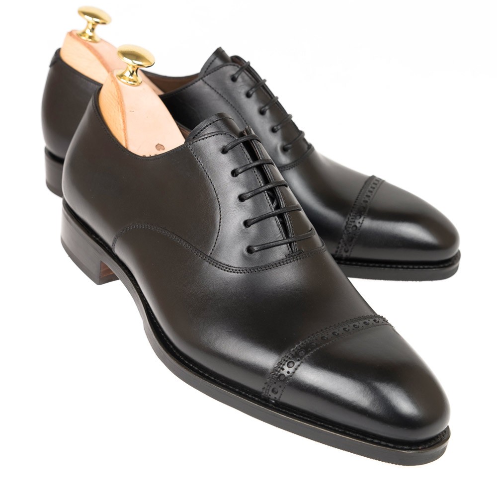 leather dress shoes in rain